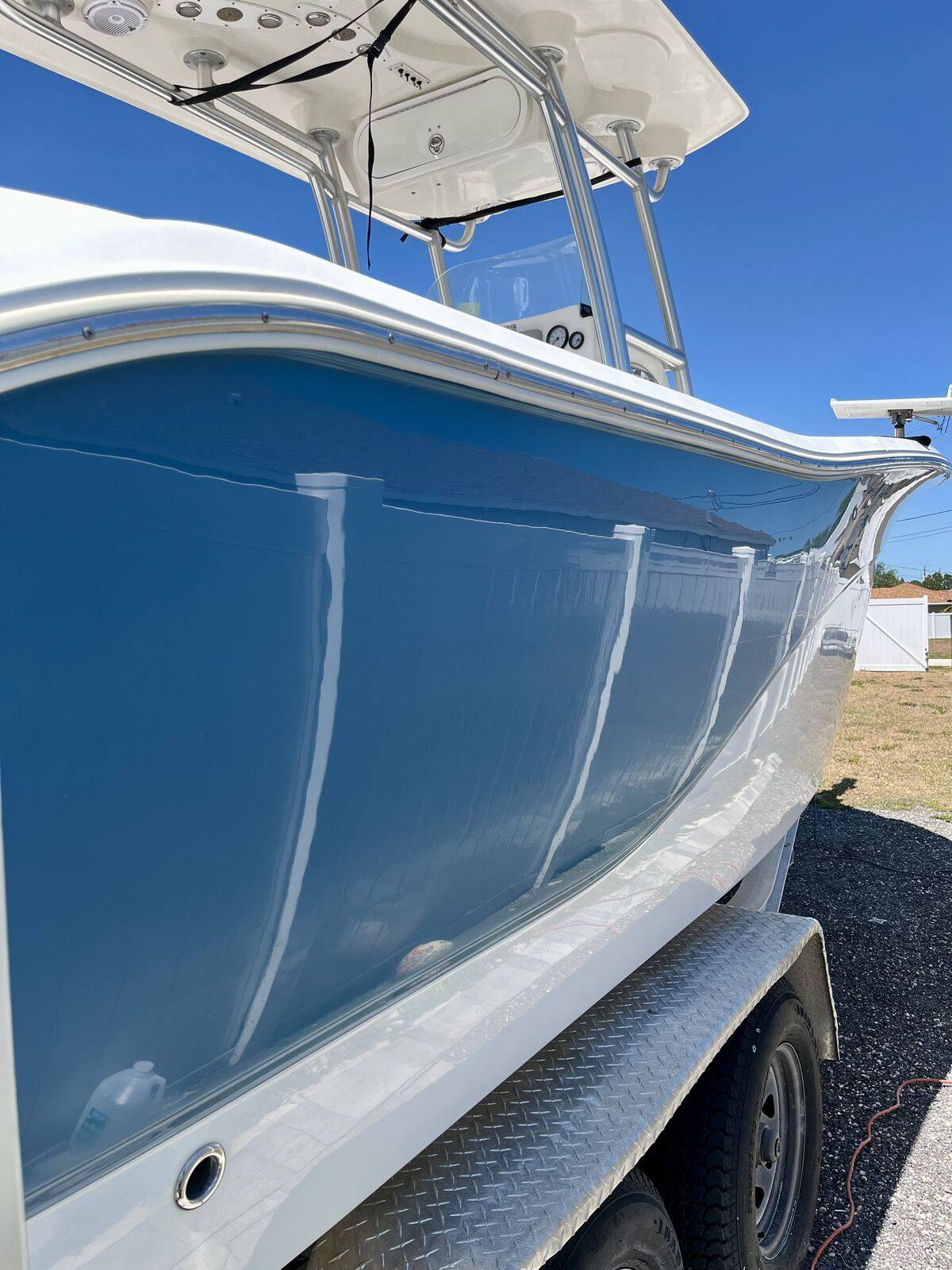 Center console boat with a freshly detailed high-gloss hull in Jupiter, Florida